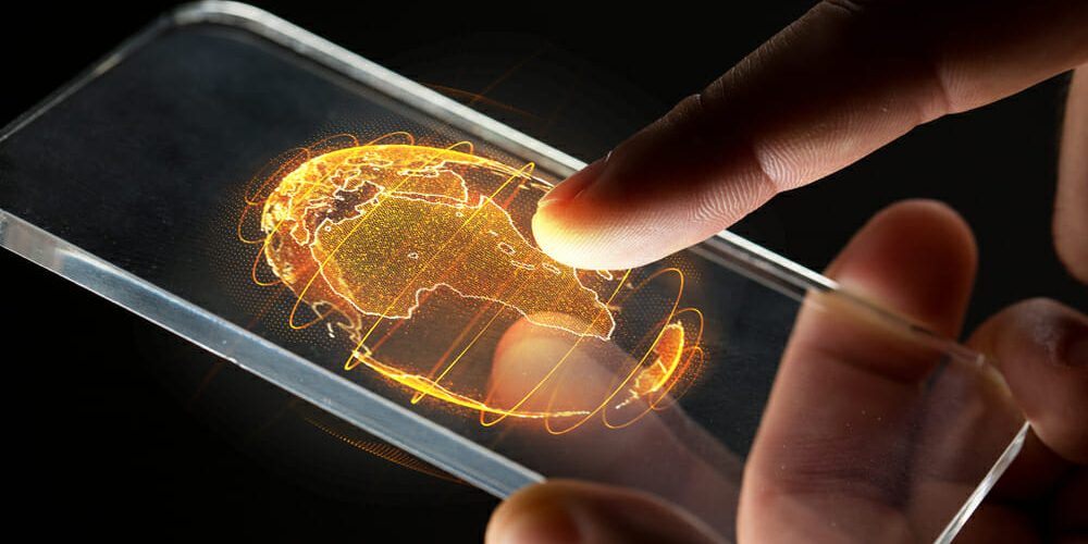 Nahaufnahme eines Smartphones mit der Abbildung eines Globus-Holograms mit Afrika im Fokus